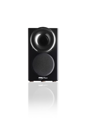 A sleek black speaker with a glossy, rounded top section and a fabric-covered lower section displaying the Stein Music logo. The speaker is reflected on the white surface it stands upon, adding a sense of elegance and modernity.