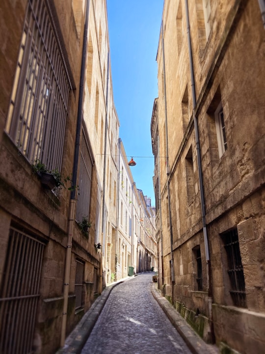 brown concrete building during daytime in Bordeaux France