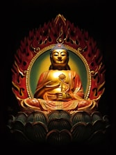 gold and red hindu deity figurine