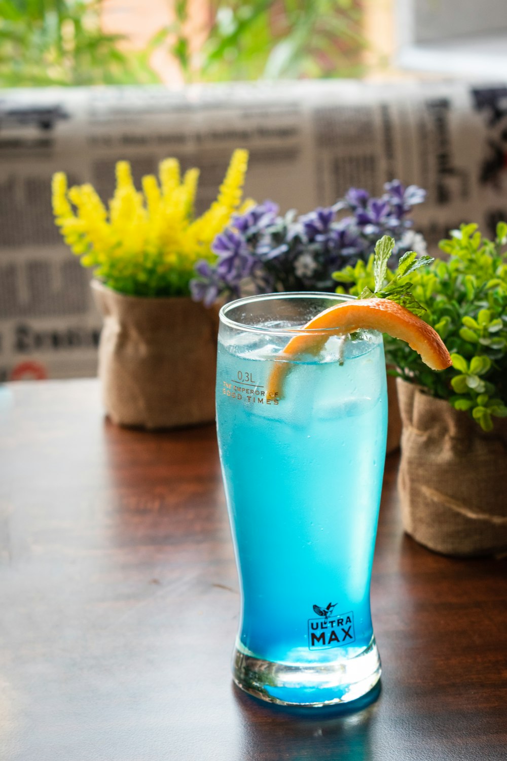 blue drinking glass with blue liquid inside