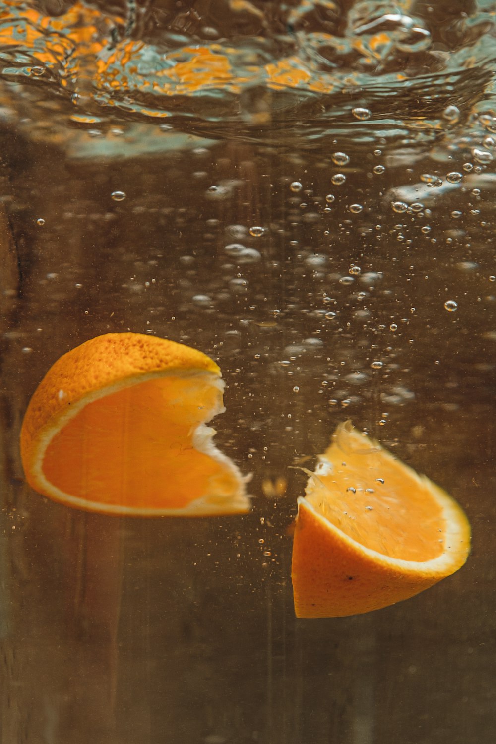 sliced orange fruit on water