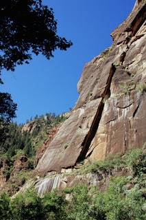 brown rock formation under blue sky during daytime