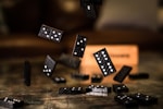 black and white dices on brown wooden table