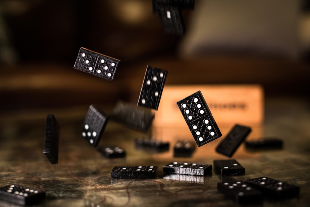 black and white dices on brown wooden table