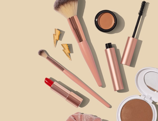Natural beauty products arranged with flowers and organic ingredients