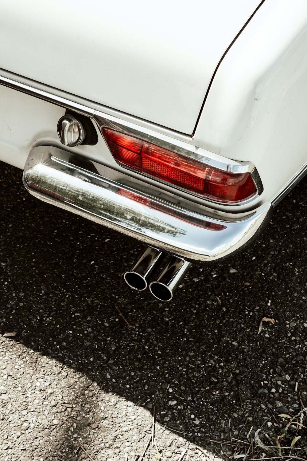 white car on black asphalt road