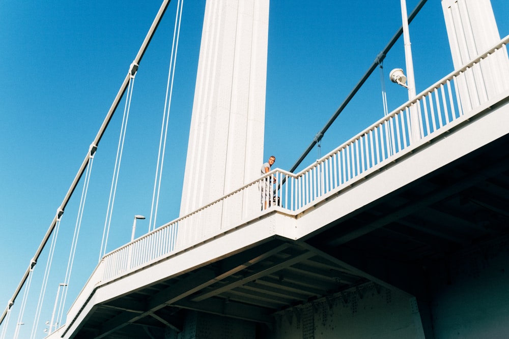 white metal bridge under blue sky during daytime