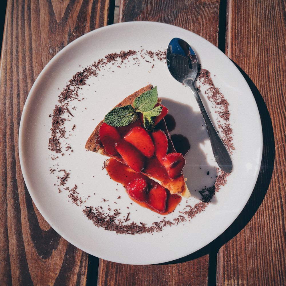 sliced strawberries on white ceramic plate