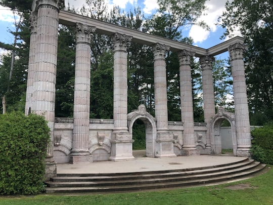 white concrete building under blue sky during daytime in Guild Park and Gardens Canada