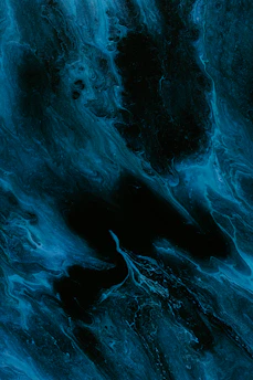 A moody, dark blue abstract swirl evoking the calm of midnight jazz.