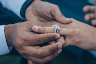 A happy couple selecting an engagement ring together.