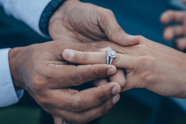 A happy couple selecting an engagement ring together.