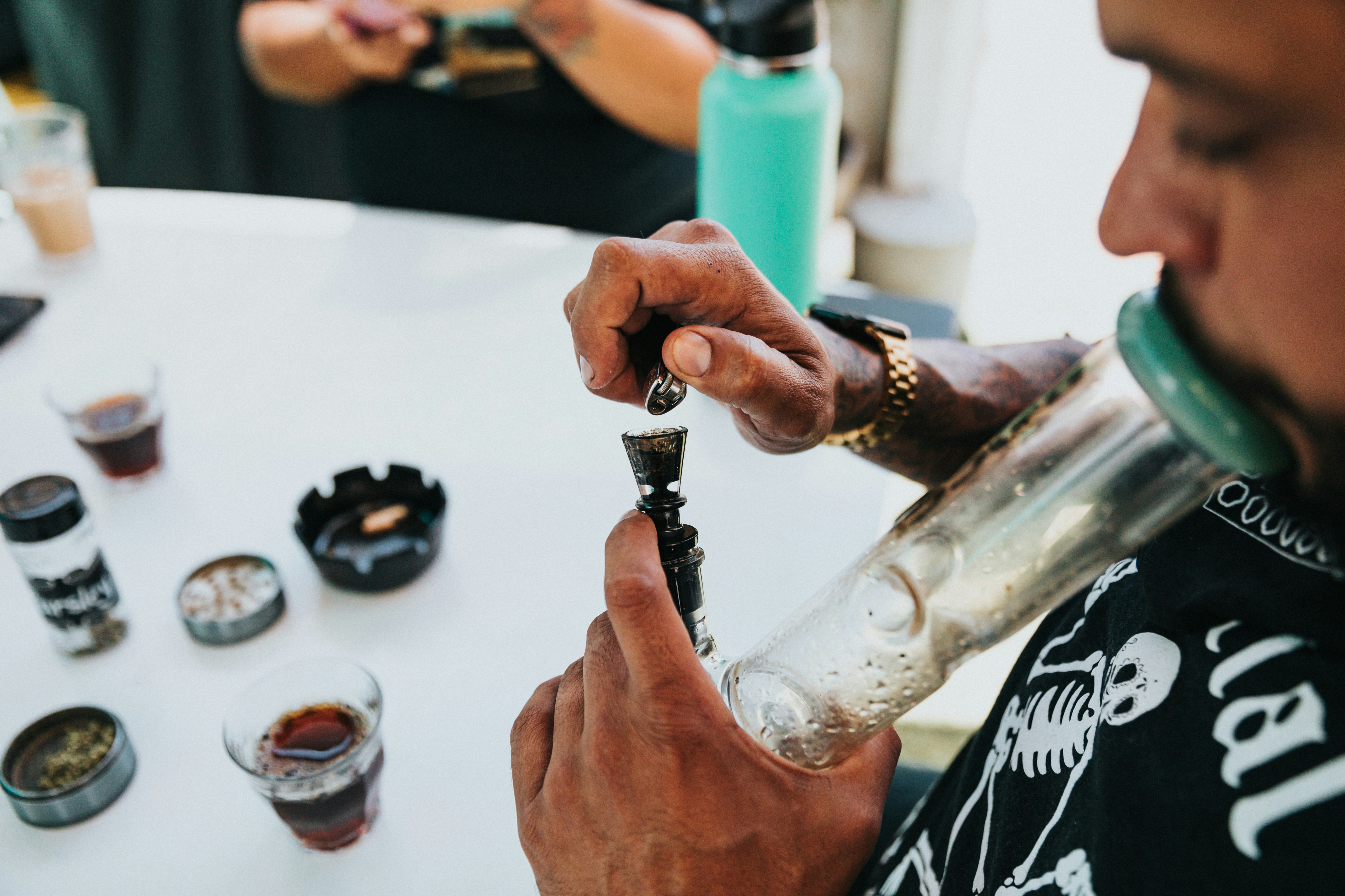 person holding silver and black tube