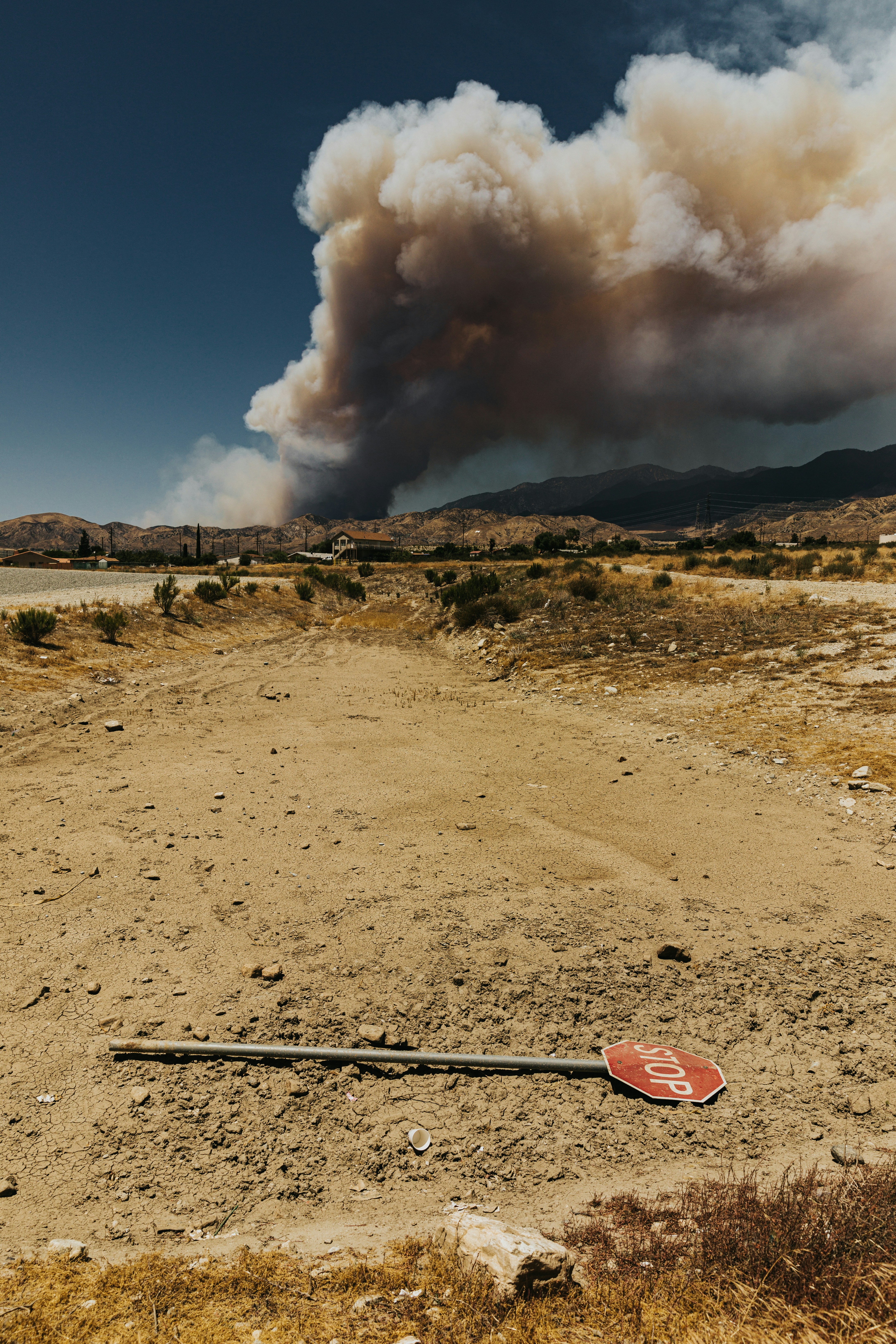 white smoke coming out from a brown field