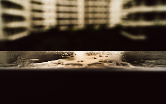 Close-up of a building surface being treated with advanced nanotechnology waterproofing.