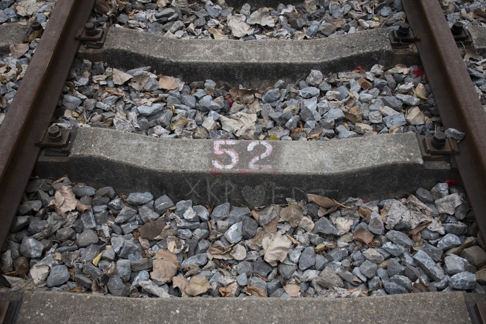 red and white arrow sign on gray concrete stairs