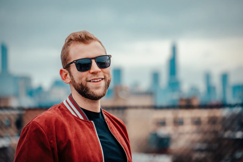 Man in a red and black shirt with sunglasses