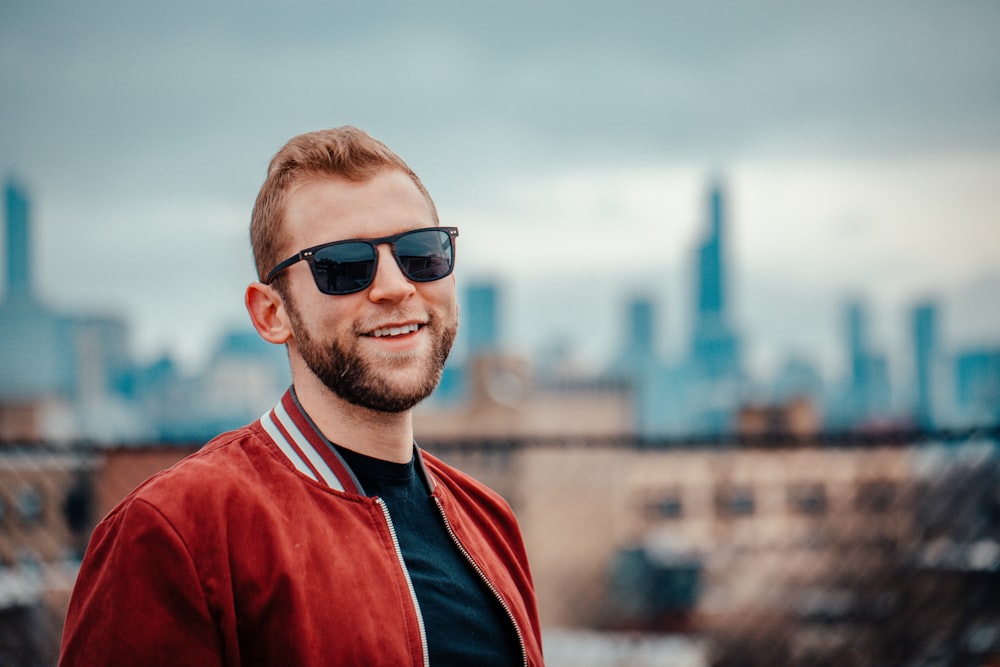 man in red and black shirt wearing black sunglasses