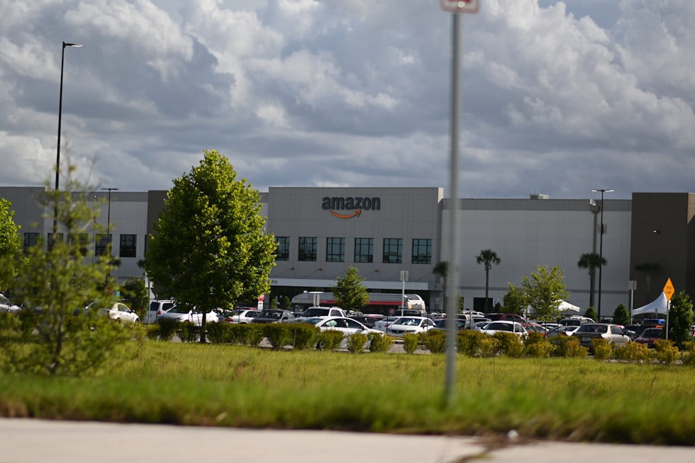 cars parked on parking lot near building during daytime