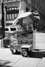 grayscale photo of utility truck with umbrella
