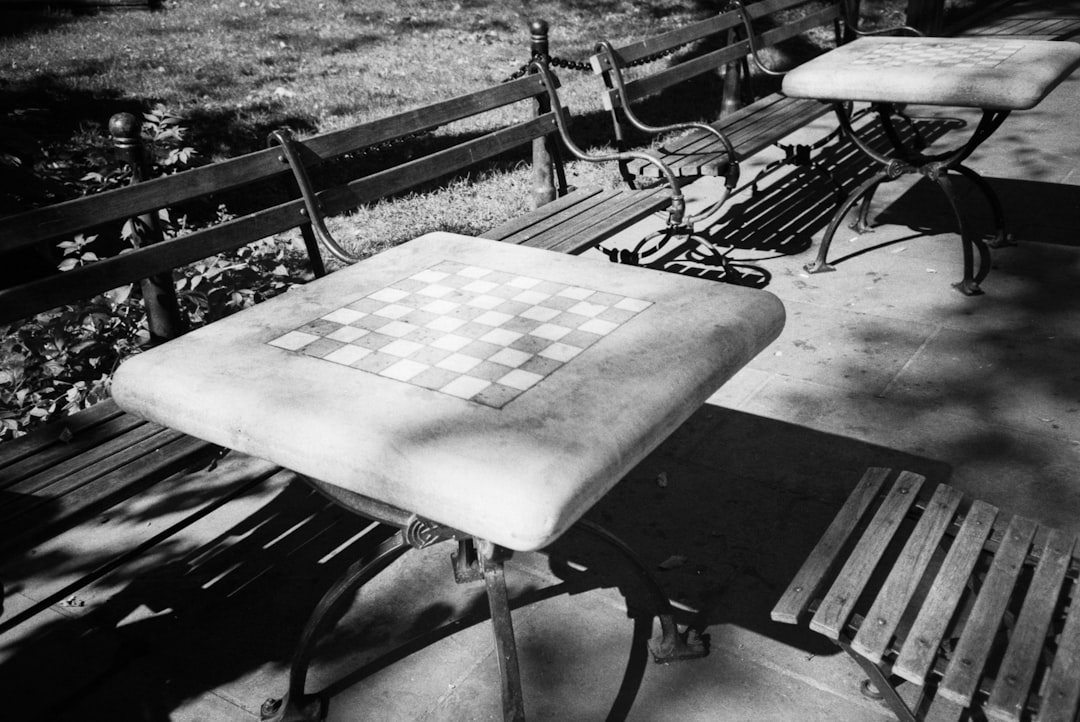 grayscale photo of wooden table