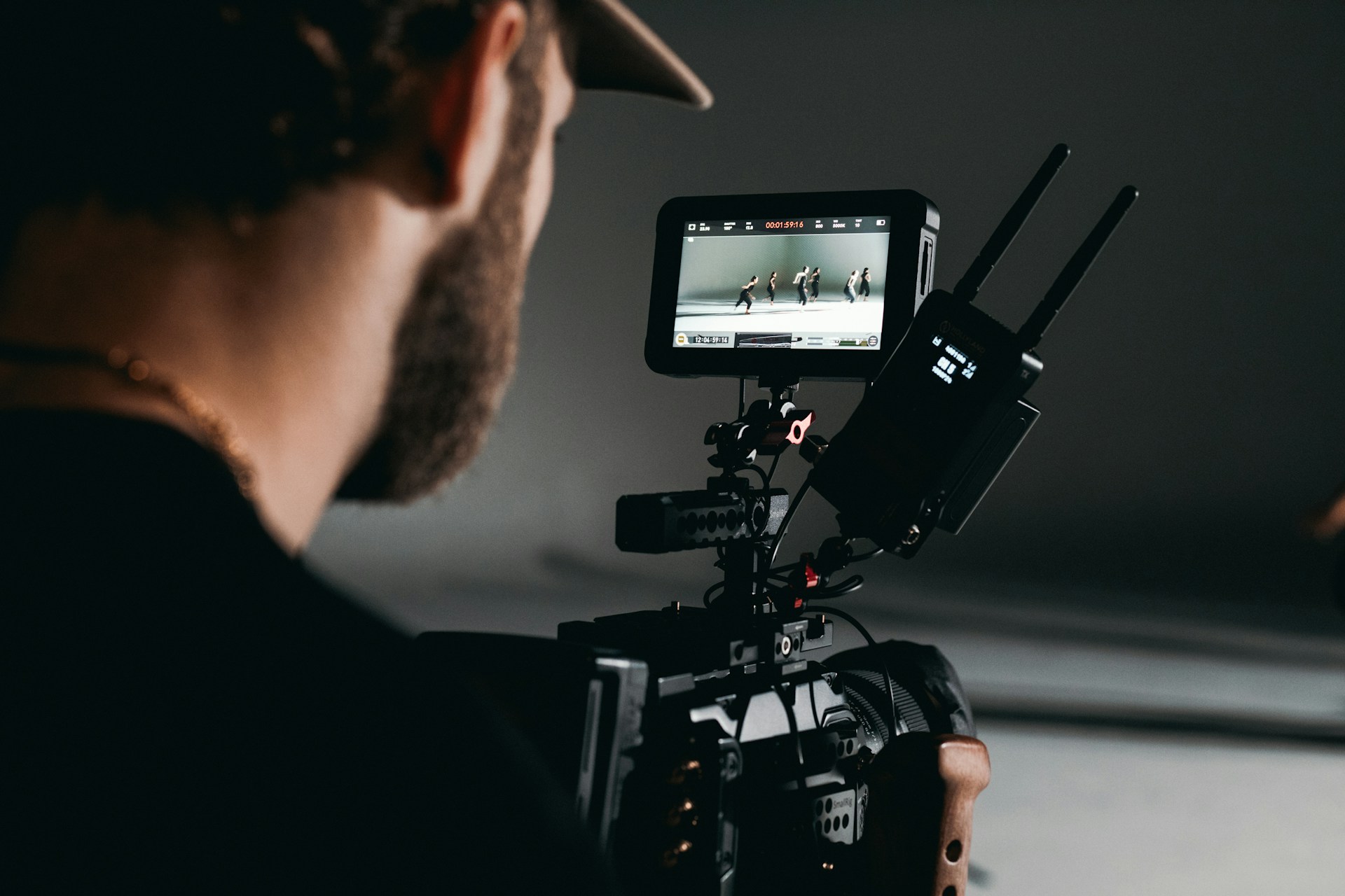 man in black shirt holding video camera