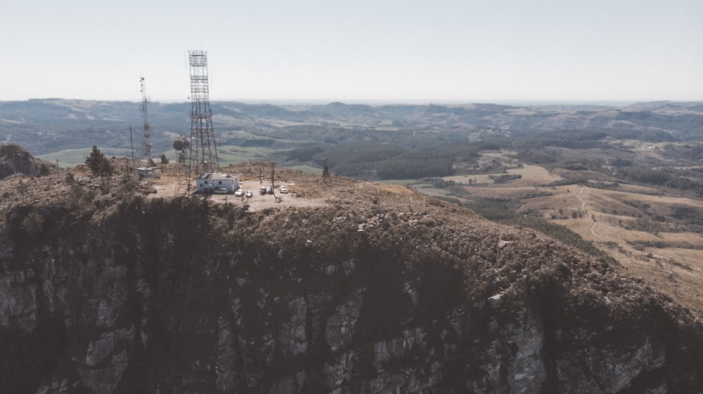 black and white tower on brown field under blue sky during daytime