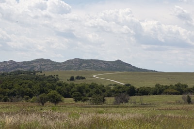 A serene landscape with a winding country road.