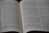 An open book displaying printed text in German, with visible page numbers including 120, 121, 122, 123, 124, 125, and 126. The text appears to be formatted in a structured manner, possibly indicating chapters or sections. The focus is primarily on the upper half of the pages.
