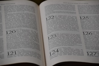 An open book displaying printed text in German, with visible page numbers including 120, 121, 122, 123, 124, 125, and 126. The text appears to be formatted in a structured manner, possibly indicating chapters or sections. The focus is primarily on the upper half of the pages.