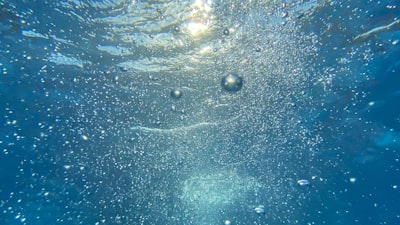 water bubbles in blue water water teams background