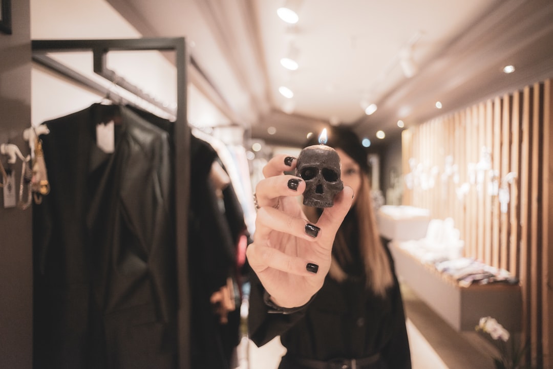 woman in black coat holding black camera