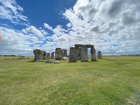 gray rock formation under blue sky during daytime in Stonehenge United Kingdom