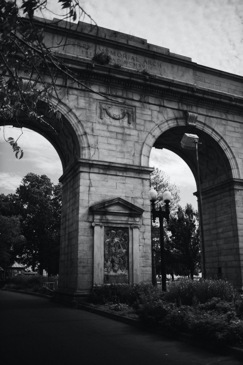 grayscale photo of arch shaped arch gate