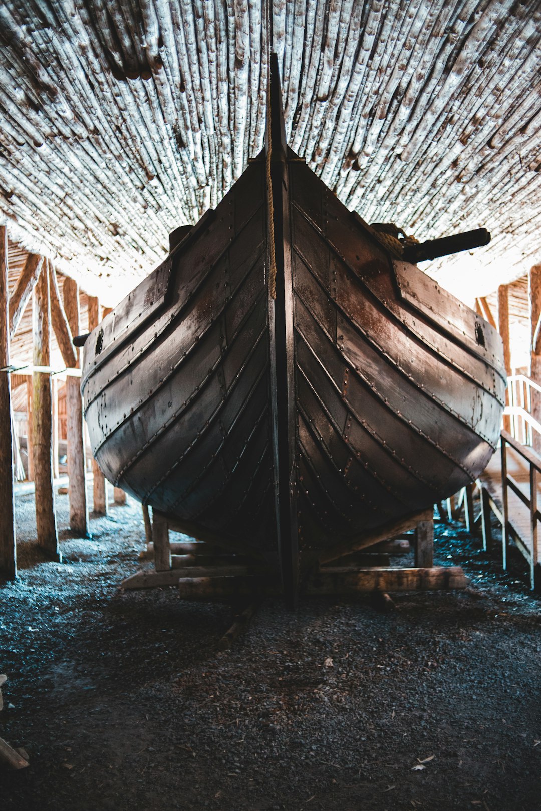 brown wooden boat on brown wooden dock during daytime