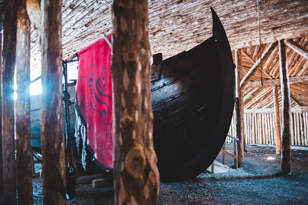 brown wooden boat on brown sand