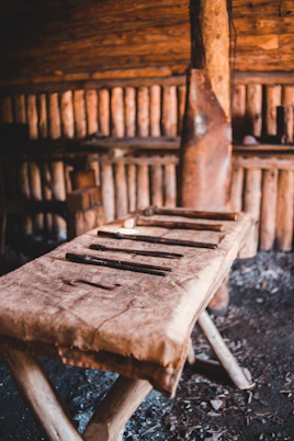 brown wooden chair on black soil