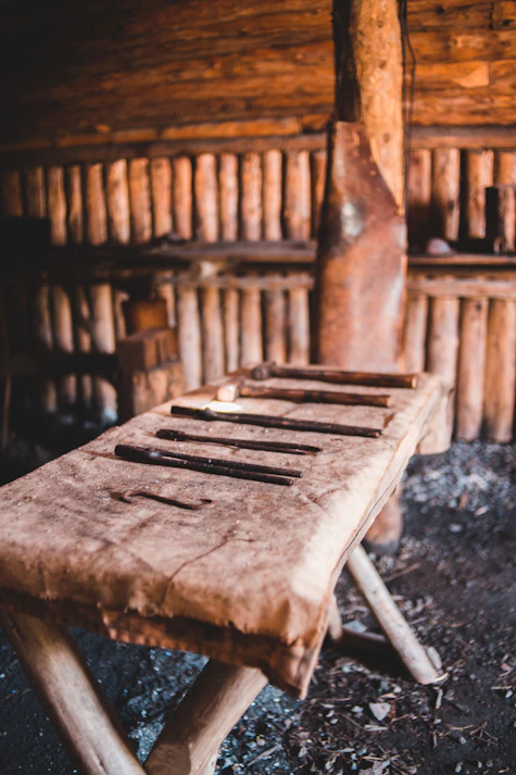 brown wooden chair on black soil