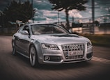 An Audi RS6 speeding down a winding road.