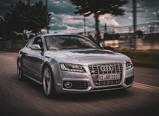 Vibrant Audi car card featuring a dynamic racing scene.
