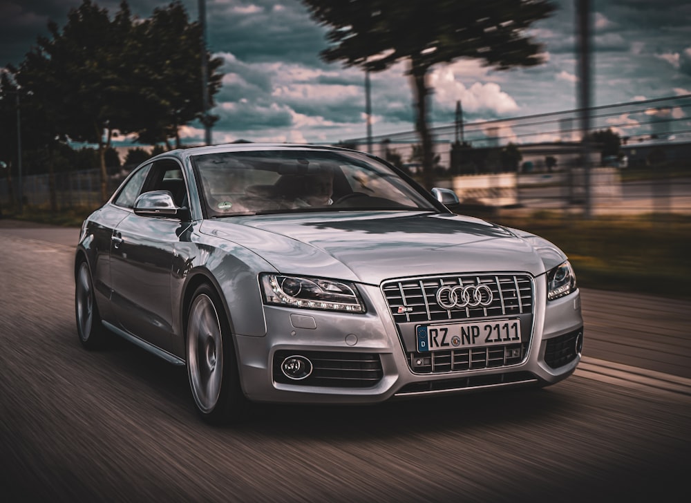 black audi a 4 coupe on road during daytime