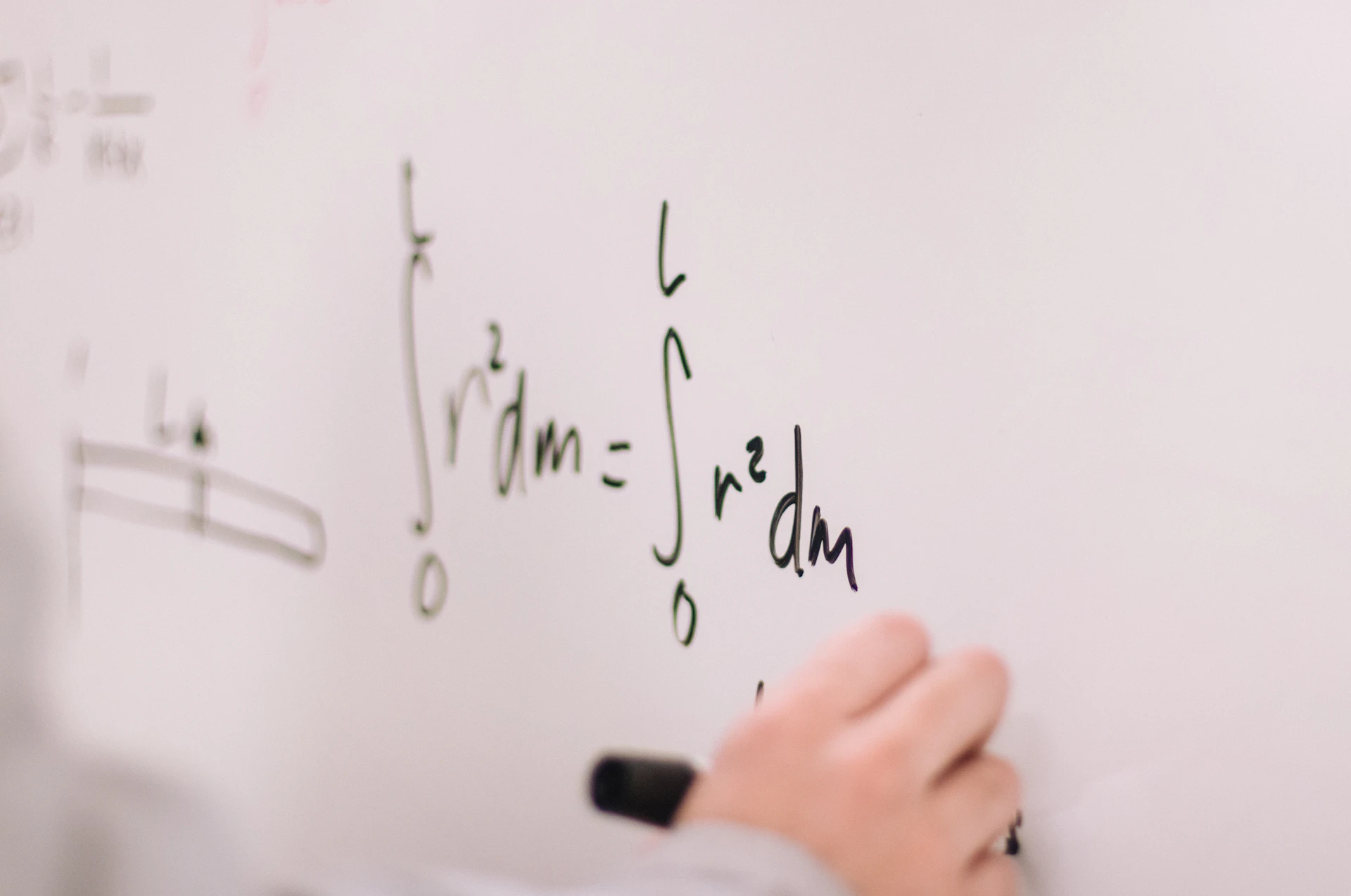 Equations written on a whiteboard during planning