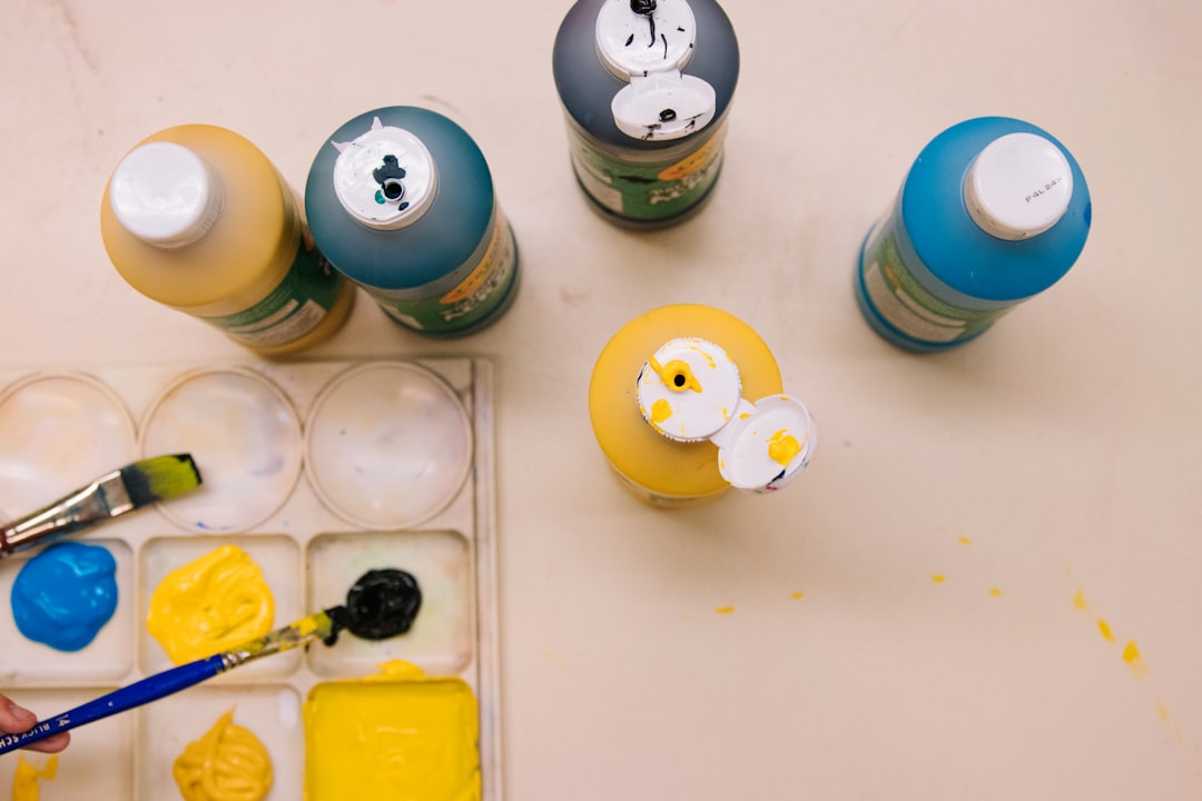 blue and yellow round plastic toy,