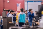 people standing in front of laptop computer