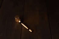 Brass and copper-based alloy samples laid out on a textured workbench.