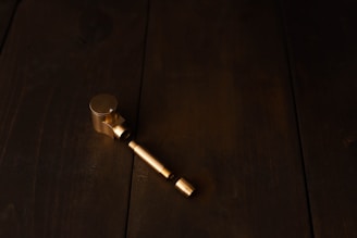 Brass and copper-based alloy samples laid out on a textured workbench.