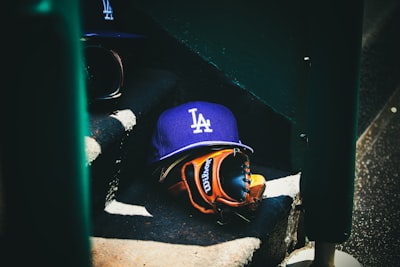 man in blue and orange helmet and goggles dodgers teams background