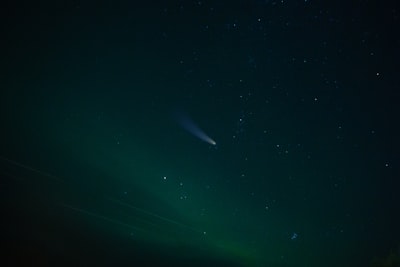 green sky during night time asteroid teams background