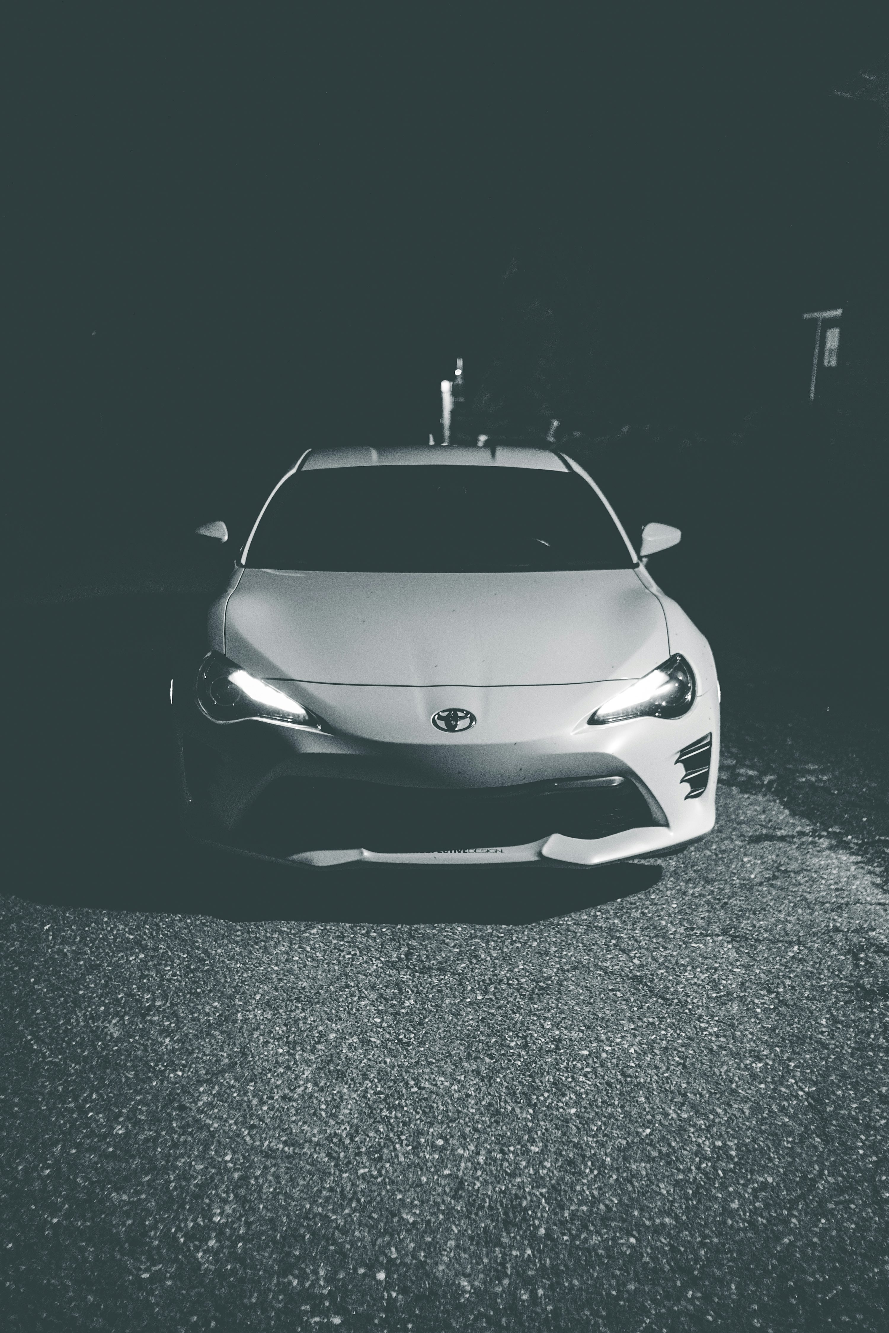 grayscale photo of white porsche 911