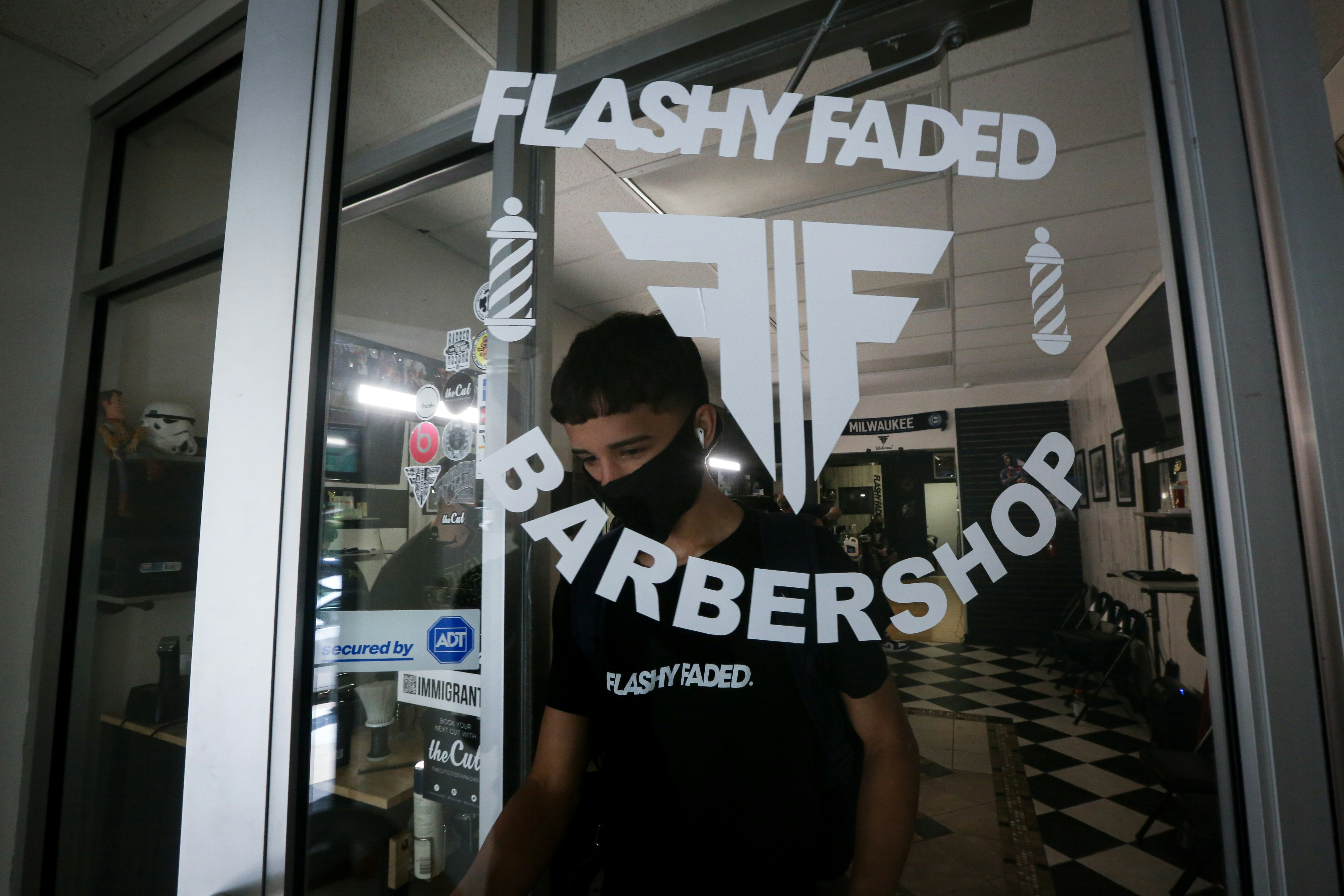 woman in black and white crew neck t-shirt wearing black sunglasses